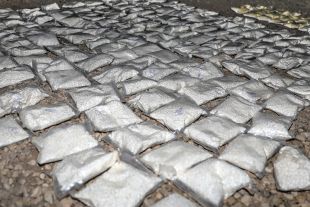Over 127 plastic bags filled with an addictive drug called Captagon lie ready for destruction after being seized by U.S. and Coalition partners in Southern Syria, May 31, 2018. Syrian government sponsors the largest Captagon drug production and smuggling network in the world, contributing to more than 80% of its global supplies. CJTF-OIR is the global Coalition to defeat ISIS in Iraq and Syria.